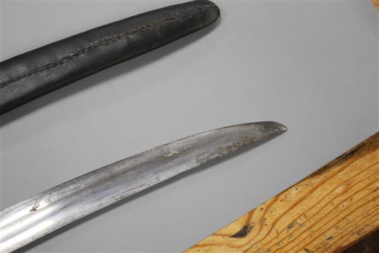 An Indian sword tulwar, silver decorated iron Lahori hilt, blade with etched inscription, 18th century, leather covered scabbard,